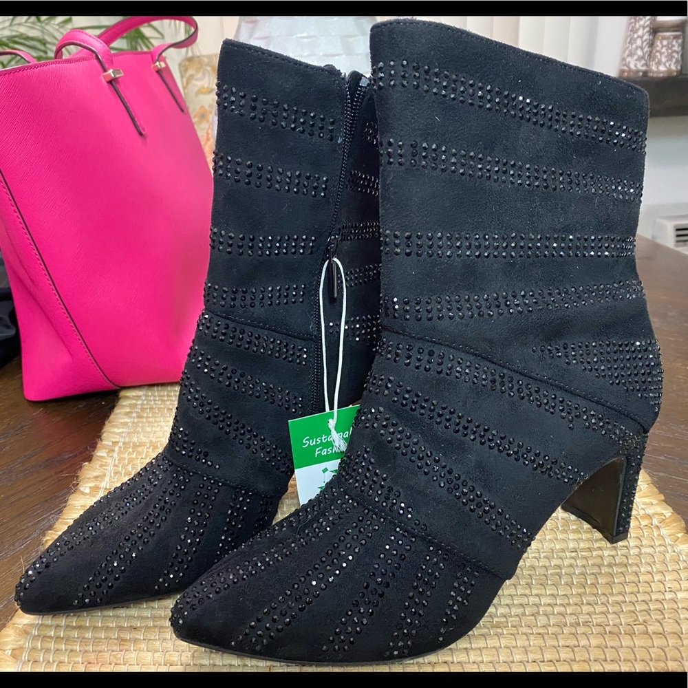 Add shimmer to every movement with the Victoria bootie from Impo.